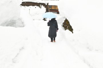 <p>She must be a tourist! She was walking very carefully so she didn&#39;t get trapped in the deep snow.</p>