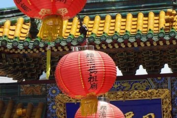 <p>Lanterns hanging in front of the templ</p>