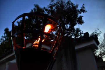 <p>Flickering flame of a torch at the entrance</p>