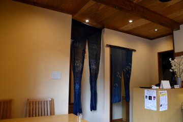 <p>A long noren curtain partitionsng off the dining area from the entrance. You are required to take off your shoes and wear slippers here.</p>