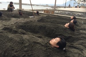 Buried under the warm sand by the beach