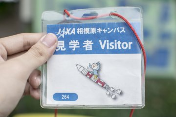 <p>Sign in at the entrance to recieve one of these cute looking visitor passes. Entry to the&nbsp;JAXA Sagamihara Campus is free and open to the public 365 days a week.</p>