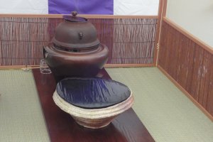 An iron pot to boil water and a water pot for this tea ceremony