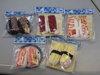 Sushi Socks come in 17 different types, including (clockwise from top left): negitoro (minced tuna and green onion), maguro (tuna), ebi (shrimp), tamago (egg), and kani (crab)