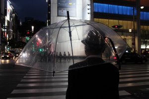 The see-through umbrella is perfect to shoot through, here capturing people on the other side