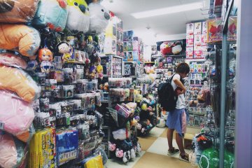 <p>One customer looks through some merchandise in one of the individual stores located on this floor.&nbsp;</p>
