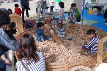 Children having genuine fun with wooden toys