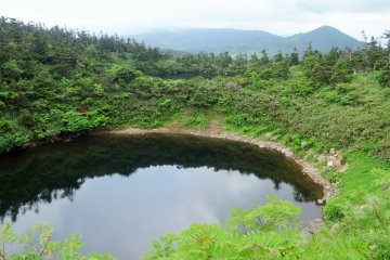 <p>A reflective lake near the end of the loop</p>