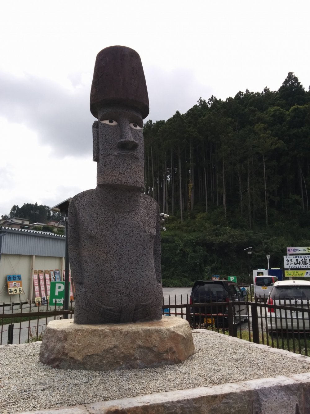 A closeup of the moai outside Sun Sun Shopping Village