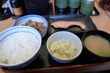 example of a set of beef, rice, miso soup, coleslaw, grilled salmon