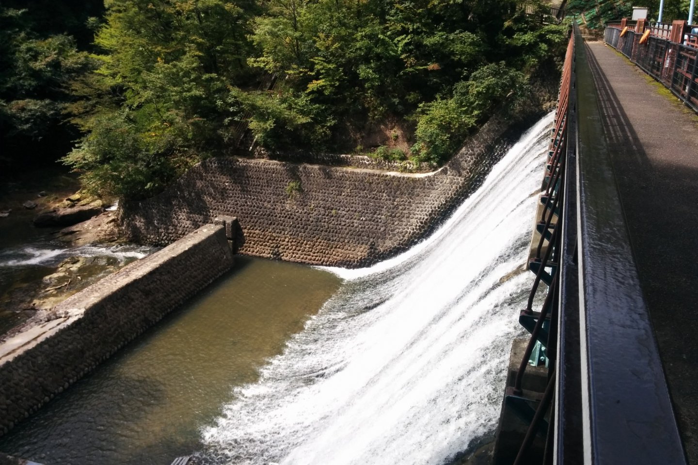 Aoshita Dam #1 is unique because of its white waterfall design