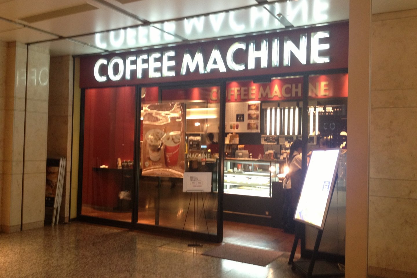 Coffee Machine from the outside. The seating spaces stretched to the left of the cashier and pantry area.