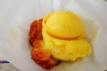<p>Andagi (Okinawan donuts) with tropical flavored ice cream are sold at one of the shops</p>
