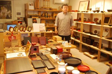 <p>Taiichi Kirimoto in his element at the shop in Honmachi, Wajima</p>
