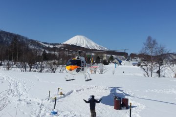 The helicopter landing with Mt Yotei in the background