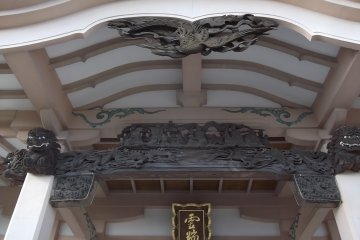 Beautifully detailed carvings under the roof
