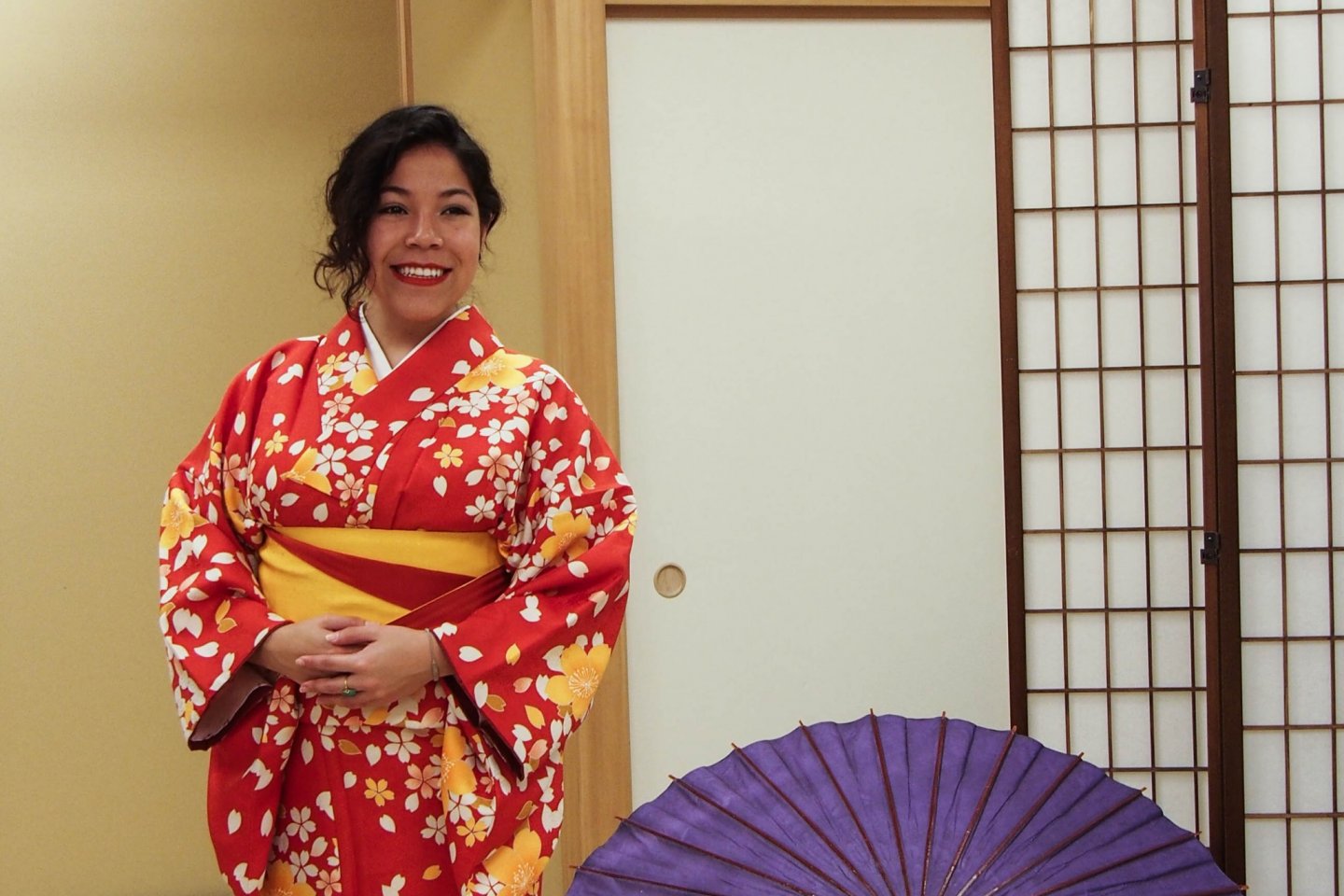 Yuriko matching her lipstick to her kimono.
