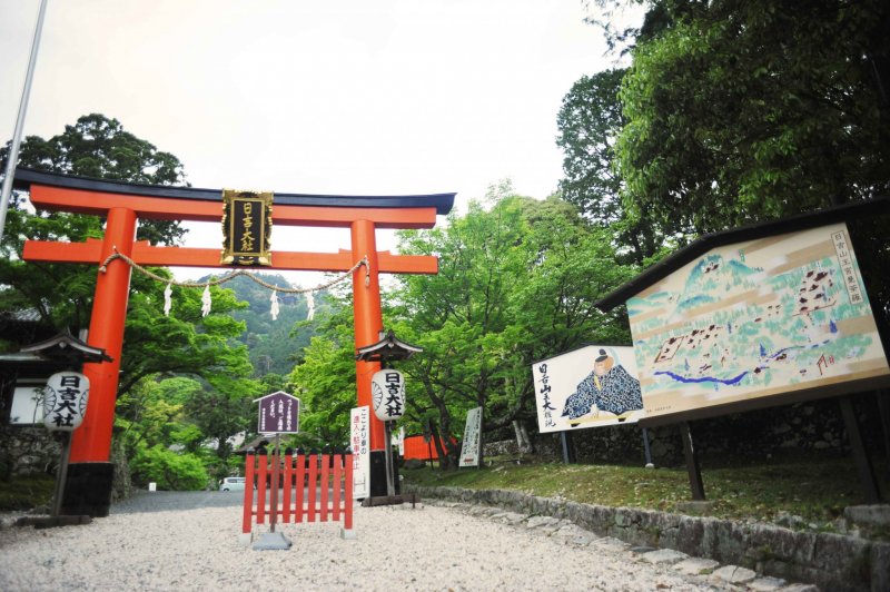 Entrance to the Hiyoshi Taisha Shrine at the foot of Mount Hiei. Stairs leading to the mountain path lie to the left of the torii gate