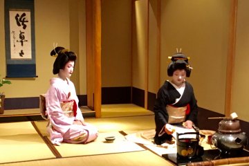 Geisha conduct a traditional tea ceremony during intermission