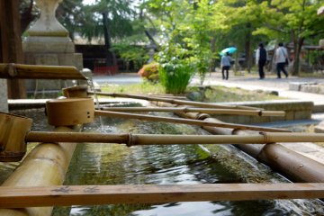 The "temizuya" water pavilion for purifying body and soul prior to presenting before of the enshrined deities