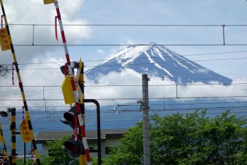 Mt. Fuji in the background framed by Kawaguchiko station can be seen from the ticket gates