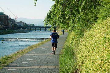 Man jogging along the riverbanks 