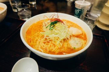 A large bowl of spicy ramen