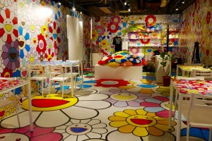 Zingaro Space, right around the corner from the cafe, is lined from top to bottom with Murakami's famous flowers
