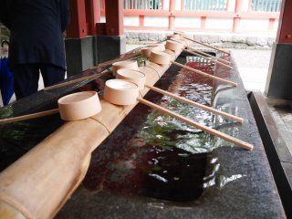 The shrine's temizuya (hand purification fountain) is just outside the shrine's central court