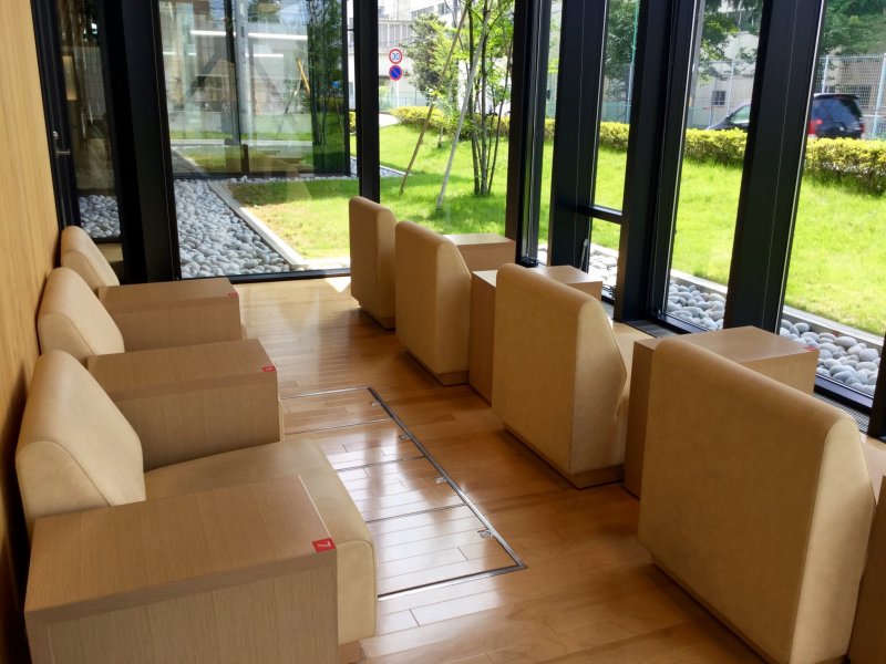 Relaxing couches facing manicured zen gardens