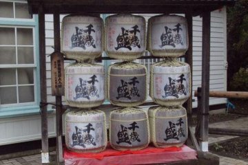 Saké drums welcome you. They are offerings for the gods, and not for visitors, however.