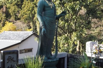 One of the serene Buddhist statues in the grounds