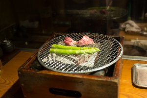 Pork and asparagus on a table top grill