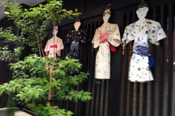 These kimono-clad figures were displayed on many of the stores