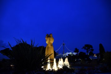 Illuminated water fountain, Goddess of Water and Hikawa-Maru under the twilight blue sky