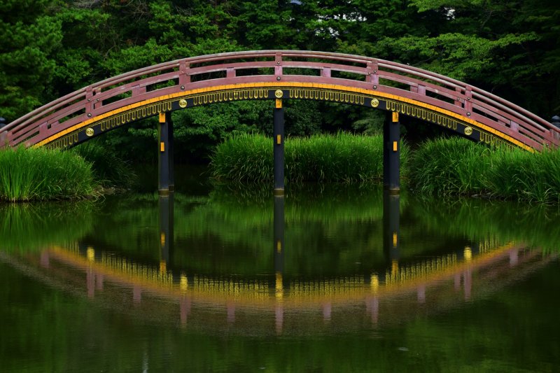 Beautiful reflection of an arched bridge