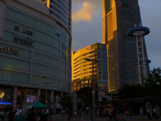 Sunset at Minato Mirai. Golden light gives life to grey buildings