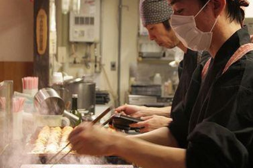 Half the fun is watching the chefs flip the delicate takoyaki with chopsticks from a special pan.