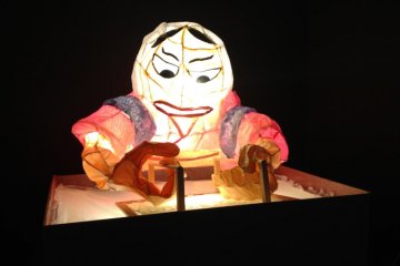 A figure of a woman making washi done in the Nebuta festival style - made by a 3rd grader.