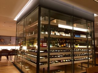 A modern-looking wine cellar in the middle of the restaurant