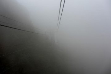 The clouds surround the cable car