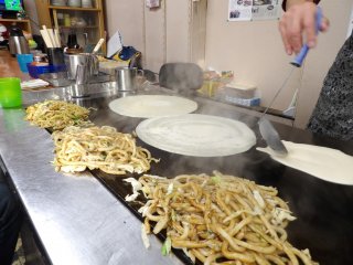 The pancake base, into which the udon will be snugly folded