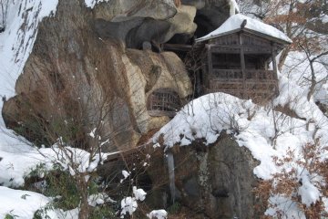 Caves carved into the volcanic rock of the mountain were used for prayer and ascetic practice in the old days