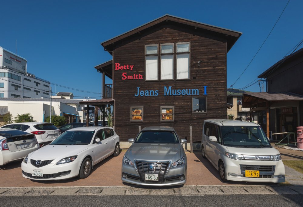 The outside of Part I of the jeans museum. This includes a display area and store.
