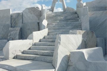 Stairs made out of marble leading up to the pinnacle of "The Heights of Eternal Hope for the Future" with the abstract "Tower of the Light" marble statue at the top, At Kosanji Temple
