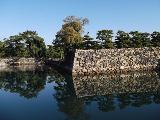 None shall pass: sturdy walls reflected in the moat