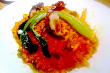 <p>Delicious and colorful risotto with eggplant and grated cheese at Kitchen Kanra</p>