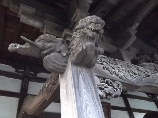 Some of the detailed carvings under the eaves of the hall