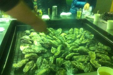 Getting the oysters on the grill