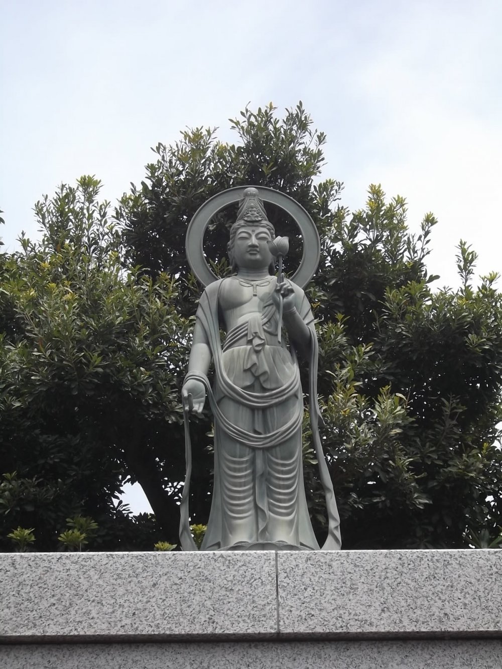 A Buddhist statue in the graveyard